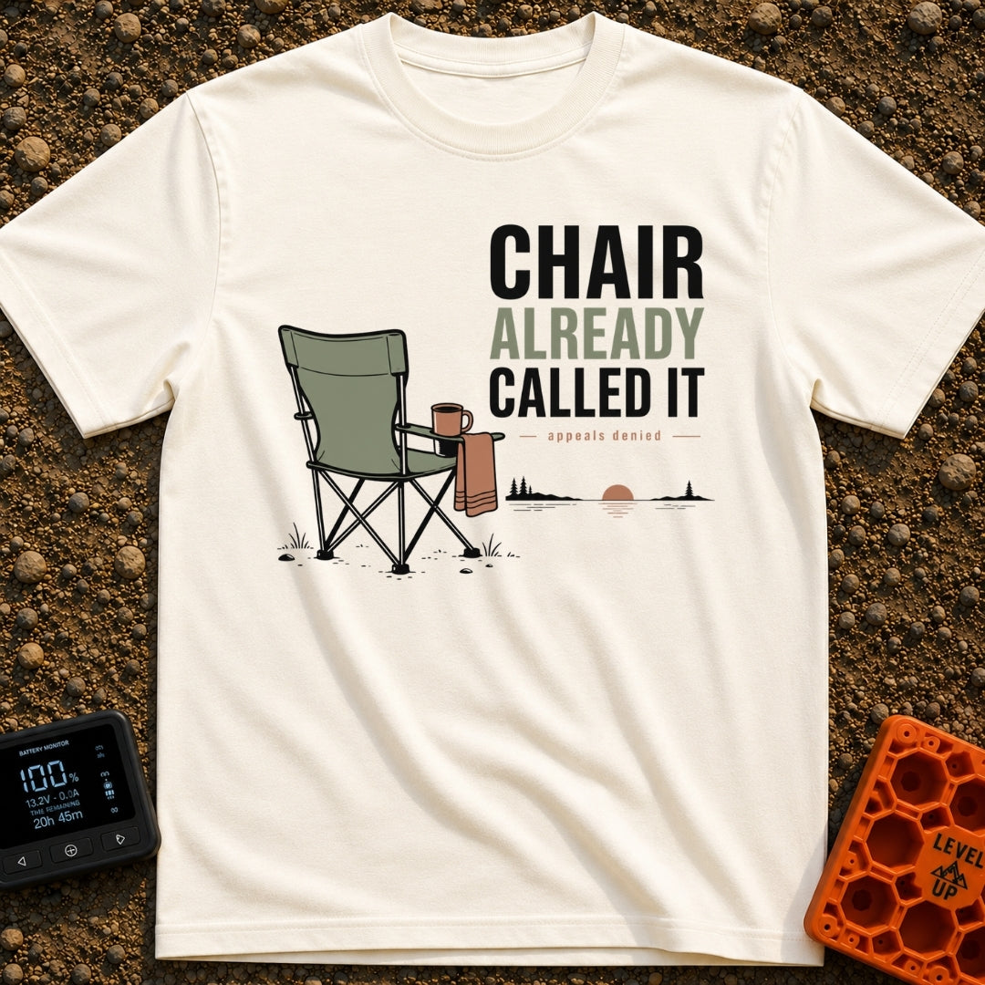 Chair Called Dibs - T-Shirt in Ivory - A green folding camp chair with a mug in its cup holder and a towel draped over...