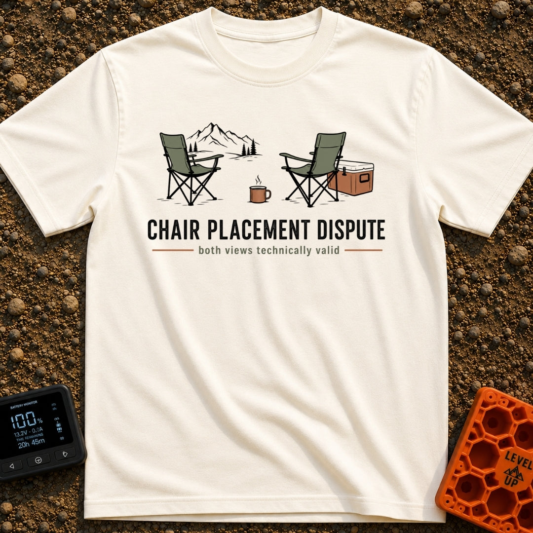 Camp Chair Diplomacy - T-Shirt in Ivory - An illustration of two green camp chairs facing in opposite directions, with...