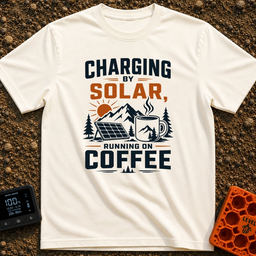 Solar Powered Coffee Fueled - T-Shirt in Ivory - A graphic illustration featuring a portable solar panel and a large...