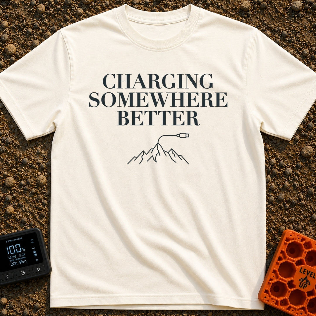 Charging Somewhere Better - T-Shirt in Ivory - Text reading "CHARGING SOMEWHERE BETTER" stacked above a minimalist line...