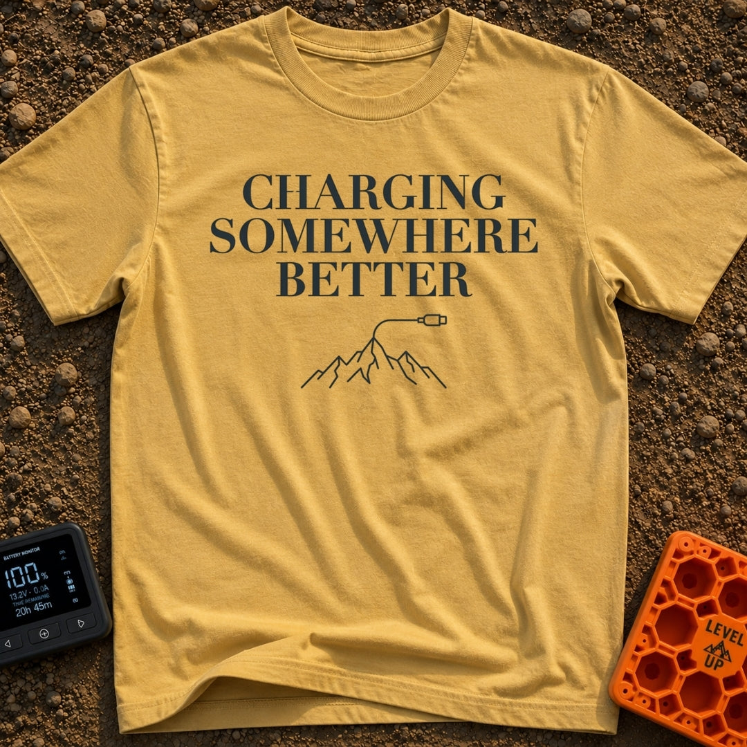 Charging Somewhere Better - T-Shirt in Mustard - Text reading "CHARGING SOMEWHERE BETTER" stacked above a minimalist line...