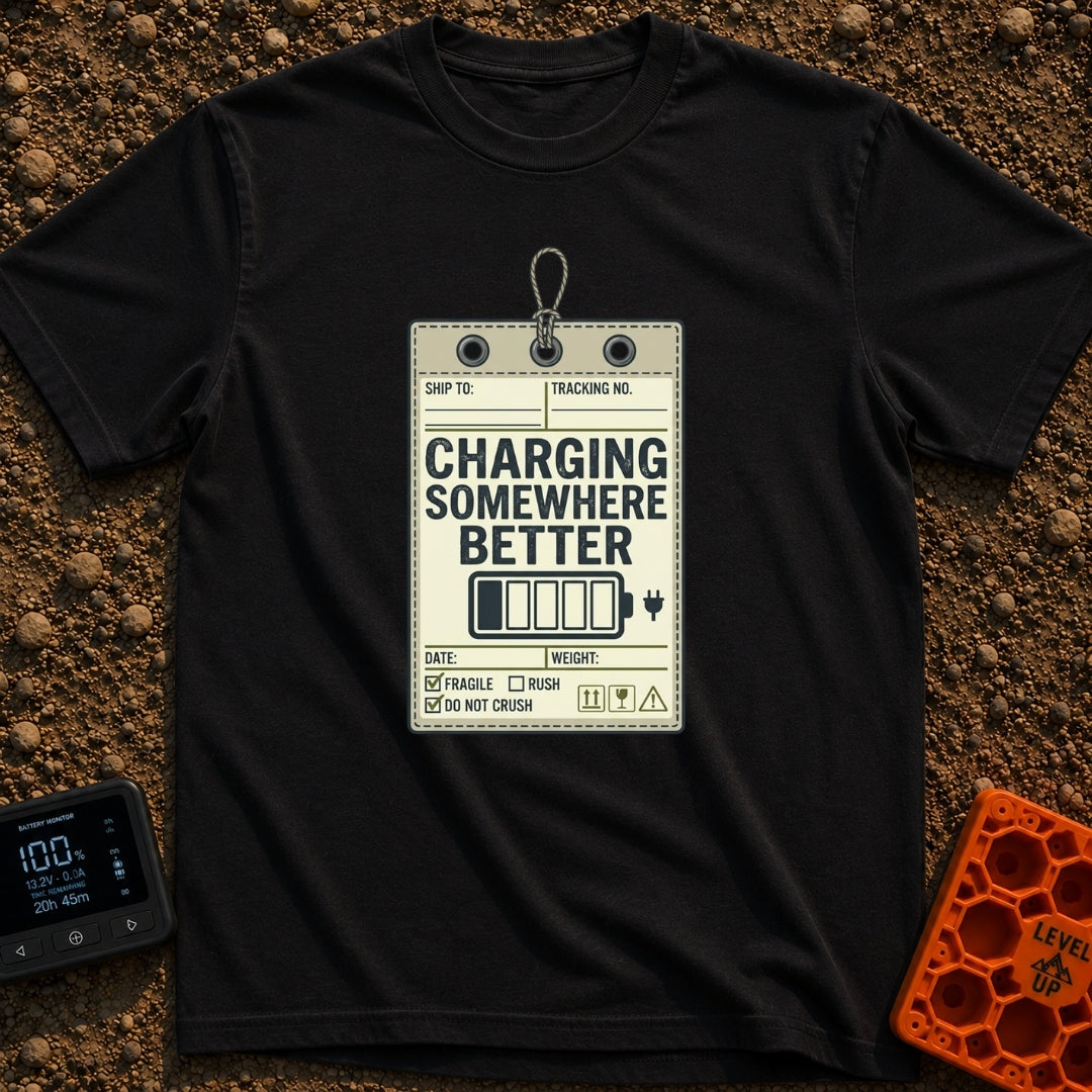 Powered by Wanderlust - T-Shirt in Black - A graphic designed to look like a vintage shipping tag with a string loop at...