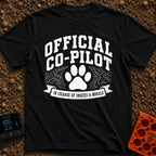 Director of Snacks - T-Shirt in Black - A black and white graphic featuring a large animal paw print centered between...