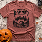 City Of The Jammed - T-Shirt in Brick - A black-and-white illustration of a rugged camper van driving on a dirt road into...