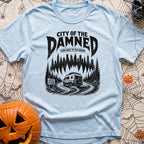 City Of The Jammed - T-Shirt in Chambray - A black-and-white illustration of a rugged camper van driving on a dirt road...