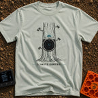 Climate Control - T-Shirt in Bay - A line drawing of a tree trunk with a circular smart thermostat embedded in the bark...
