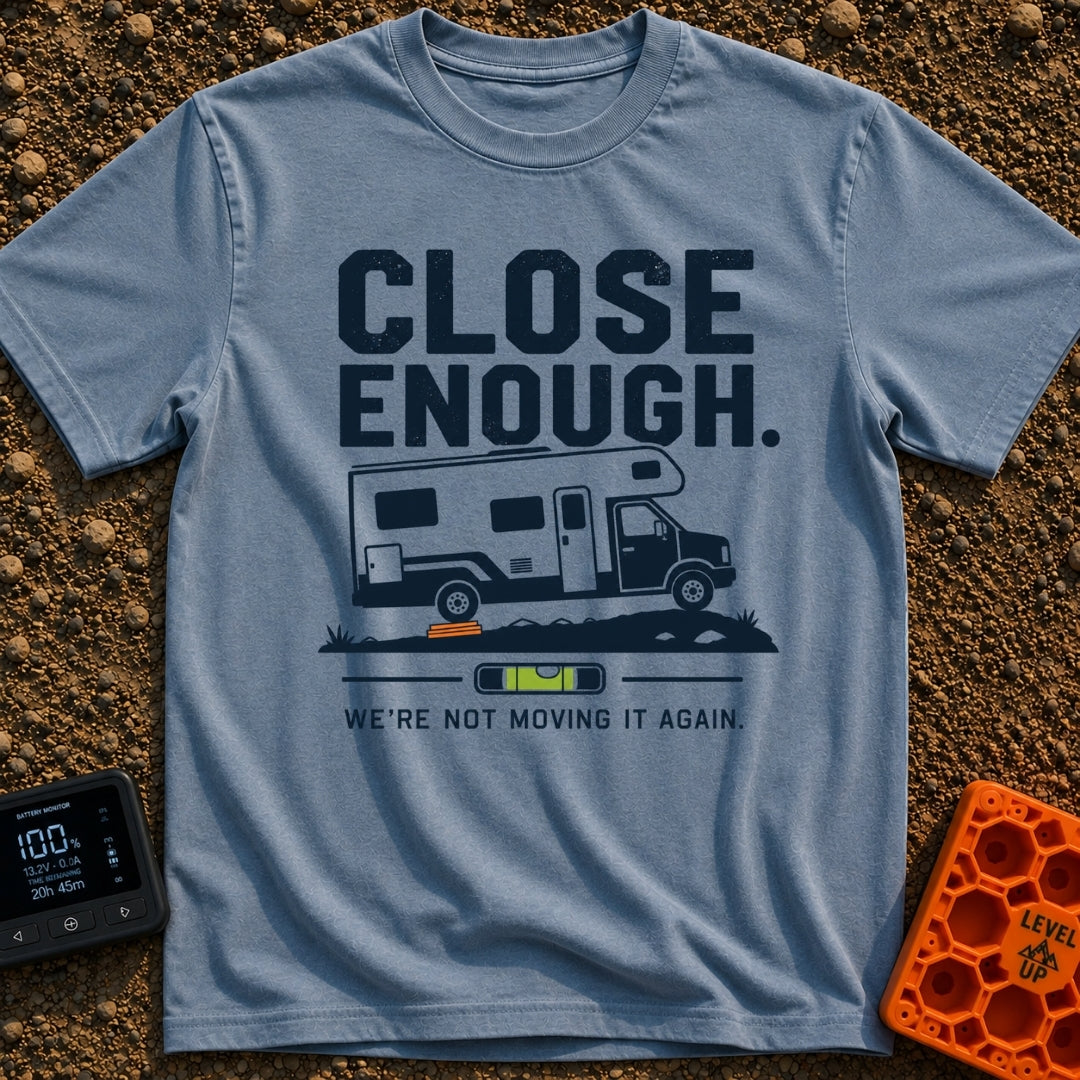 Not Moving It Again - T-Shirt in Blue Jean - A graphic design featuring a Class C motorhome parked on uneven ground with...