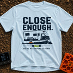 Not Moving It Again - T-Shirt in Chambray - A graphic design featuring a Class C motorhome parked on uneven ground with...