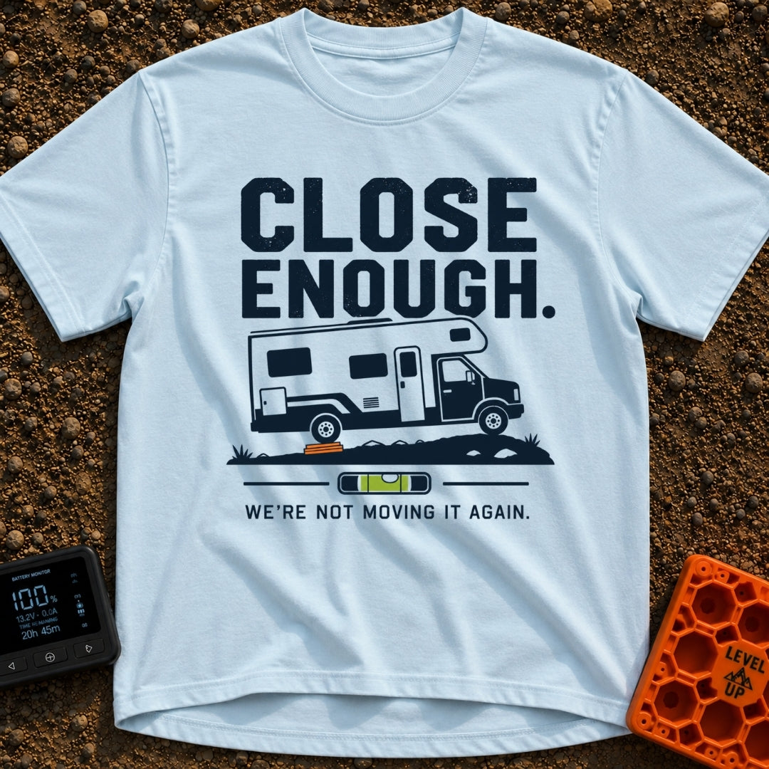 Not Moving It Again - T-Shirt in Chambray - A graphic design featuring a Class C motorhome parked on uneven ground with...