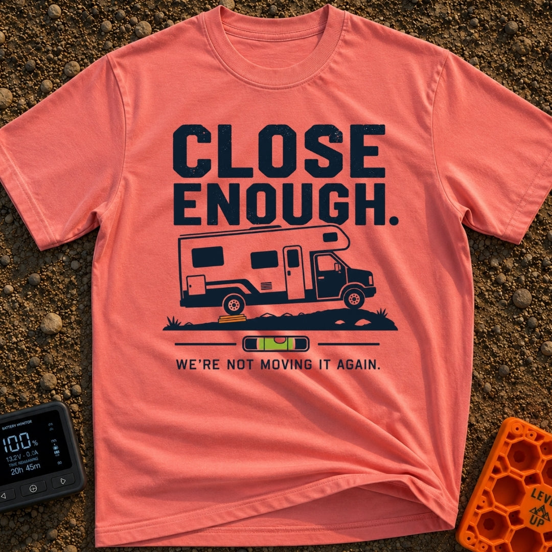 Not Moving It Again - T-Shirt in Watermelon - A graphic design featuring a Class C motorhome parked on uneven ground with...
