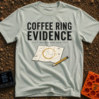 Brewed Trail Mystery - T-Shirt in Bay - The artwork shows the text "COFFEE RING EVIDENCE" and "decision made here" above...