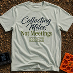 Miles Over Meetings - T-Shirt in Bay - Text reading "Collecting Miles, Not Meetings" displayed above a simple line...