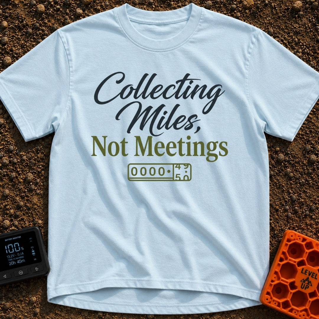 Miles Over Meetings - T-Shirt in Chambray - Text reading "Collecting Miles, Not Meetings" displayed above a simple line...