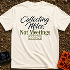Miles Over Meetings - T-Shirt in Ivory - Text reading "Collecting Miles, Not Meetings" displayed above a simple line...