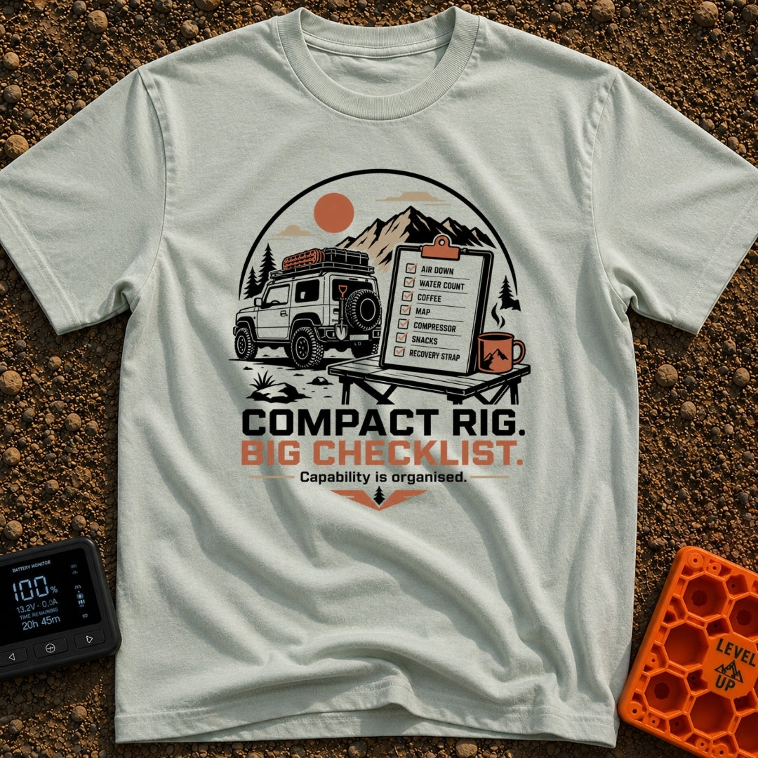Tiny Rig Big Checklist - T-Shirt in Bay - A small 4x4 vehicle with a roof rack and off-road gear parked in front of...