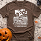 Dew Or Die - T-Shirt in Espresso - A white line drawing from the perspective of a vehicle's front seat, showing a hand...