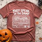 Dampening My Spirits - T-Shirt in Brick - A distressed white line-drawing showing the interior dashboard of a van with a...