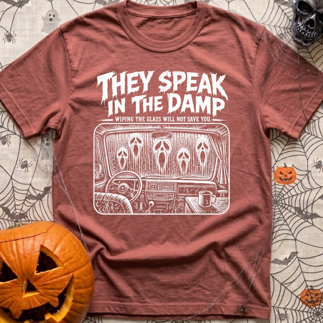 Dampening My Spirits - T-Shirt in Brick - A distressed white line-drawing showing the interior dashboard of a van with a...