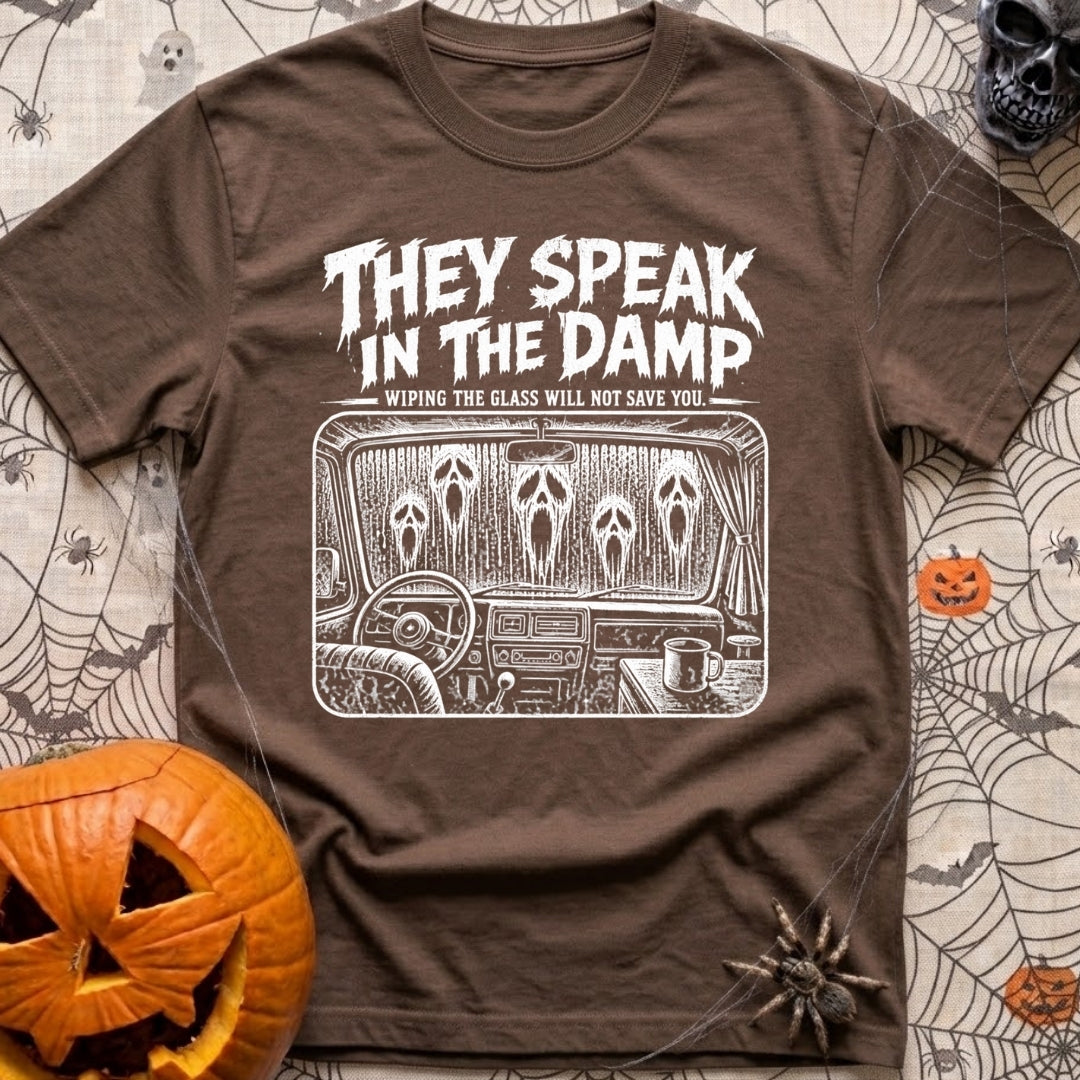 Dampening My Spirits - T-Shirt in Espresso - A distressed white line-drawing showing the interior dashboard of a van with...