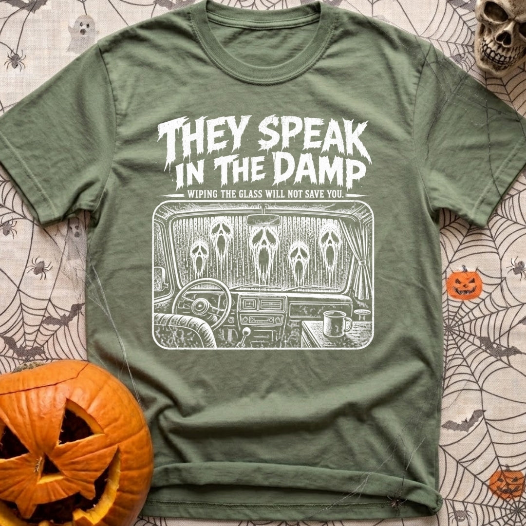 Dampening My Spirits - T-Shirt in Moss - A distressed white line-drawing showing the interior dashboard of a van with a...