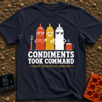 Condiments Take The Wheel - T-Shirt in Navy - Three cartoon condiment bottles—ketchup, mustard, and mayonnaise—wearing...