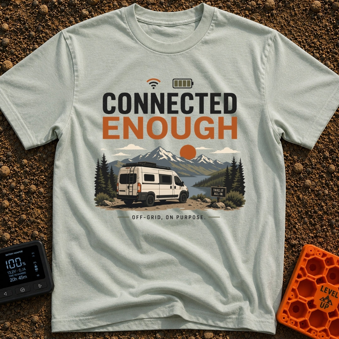 Just Connected Enough - T-Shirt in Bay - A white camper van parked on a dirt path overlooking a lake, pine trees, and...
