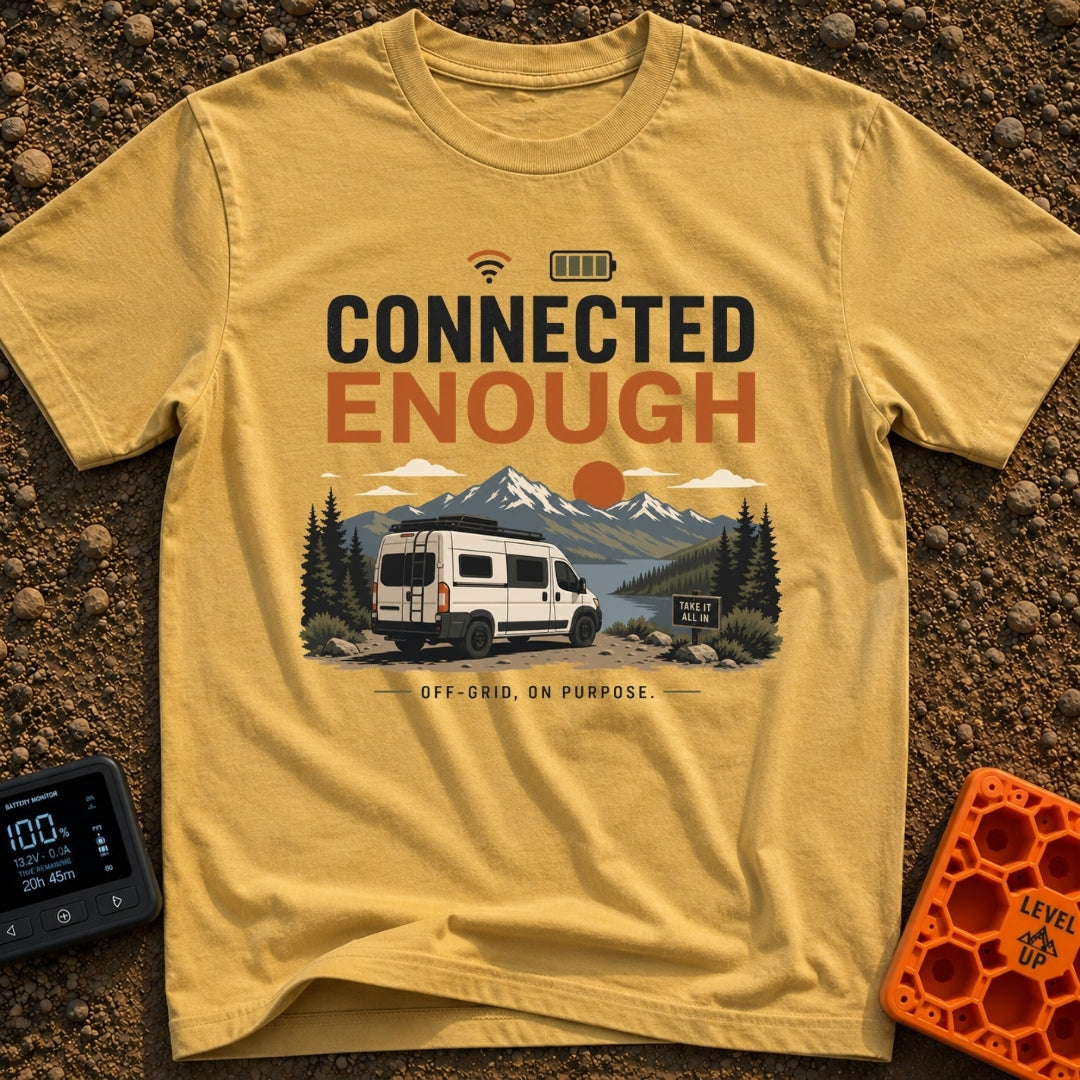 Just Connected Enough - T-Shirt in Mustard - A white camper van parked on a dirt path overlooking a lake, pine trees, and...