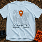 Where It Counts - T-Shirt in Chambray - A graphic featuring a stylized orange map pin pointing downward onto a background...