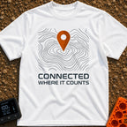 Where It Counts - T-Shirt in White - A graphic featuring a stylized orange map pin pointing downward onto a background of...