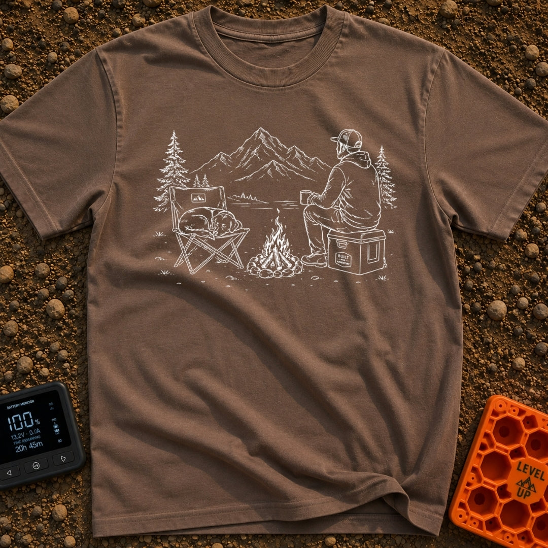 Cooler Recess Recharge - T-Shirt in Espresso - A line drawing of a person sitting on a cooler by a campfire, holding a...