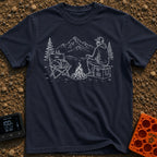 Cooler Recess Recharge - T-Shirt in Navy - A line drawing of a person sitting on a cooler by a campfire, holding a mug...