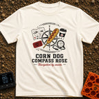 Snacks Guide Me - T-Shirt in Ivory - An illustration of a compass rose overlaid with a large corn dog, surrounded by a...
