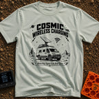 Charged By The Cosmos - T-Shirt in Bay - A black and white illustration of a rugged camper van parked on a rocky,...