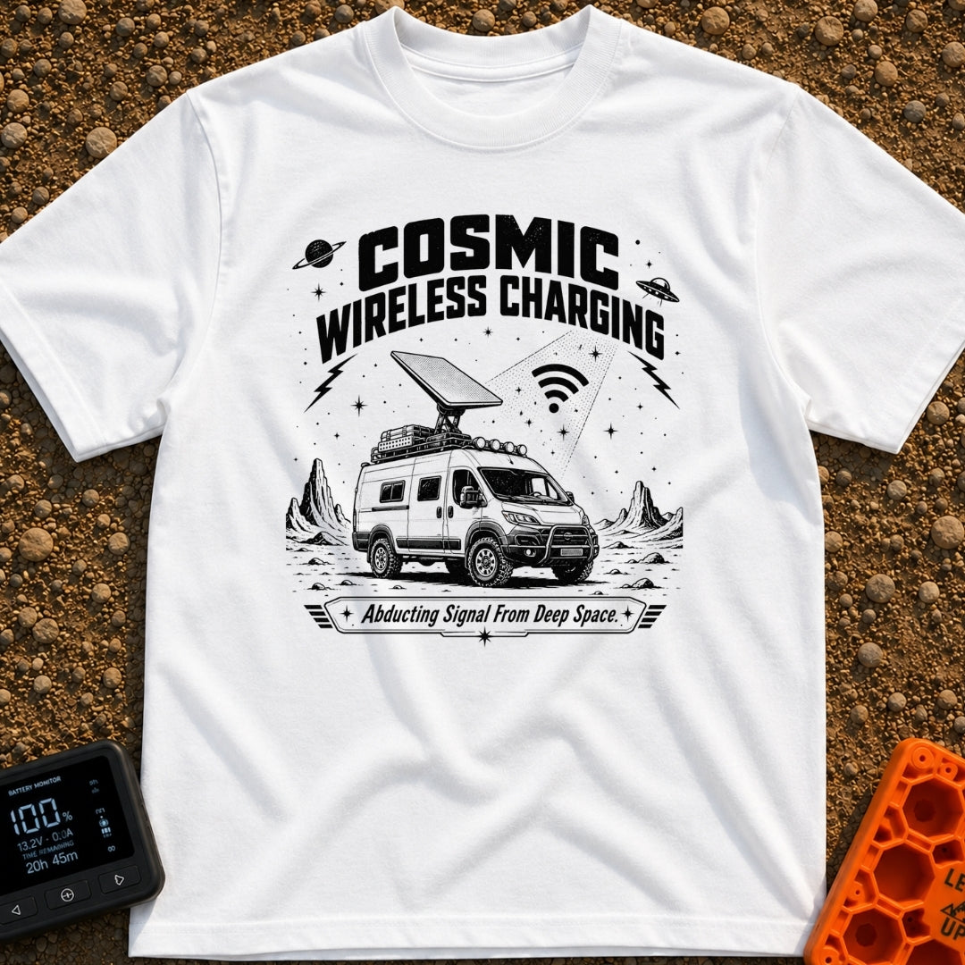 Charged By The Cosmos - T-Shirt in White - A black and white illustration of a rugged camper van parked on a rocky,...