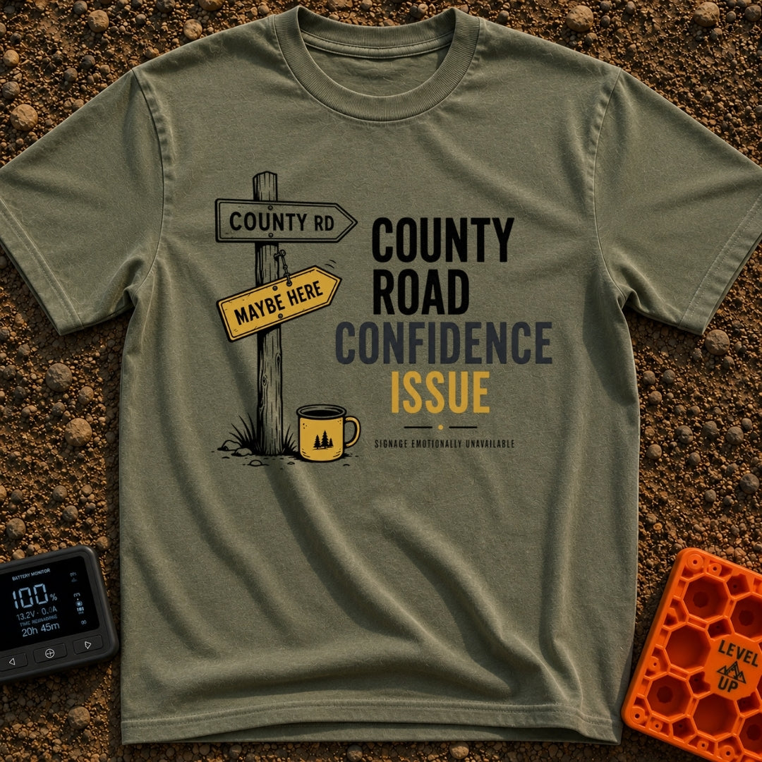 County Road Confidence - T-Shirt in Moss - A wooden signpost stands in grass featuring two directional signs reading...