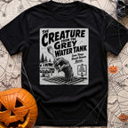 The Grey Water Creature - T-Shirt in Black - A black-and-white illustration of a scaly, dripping monster hand reaching...