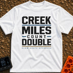 Creek Miles Count Double - T-Shirt in White - A text-based design featuring the words 'CREEK MILES' and 'DOUBLE' in large...