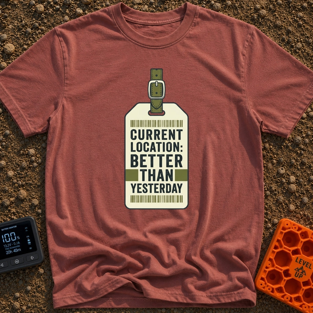 Better Than Yesterday - T-Shirt in Brick - A graphic of a vintage-style luggage tag with an olive green buckled strap,...