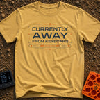 Away From Keyboard - T-Shirt in Mustard - A graphic design featuring the text "CURRENTLY AWAY FROM KEYBOARD" surrounded...