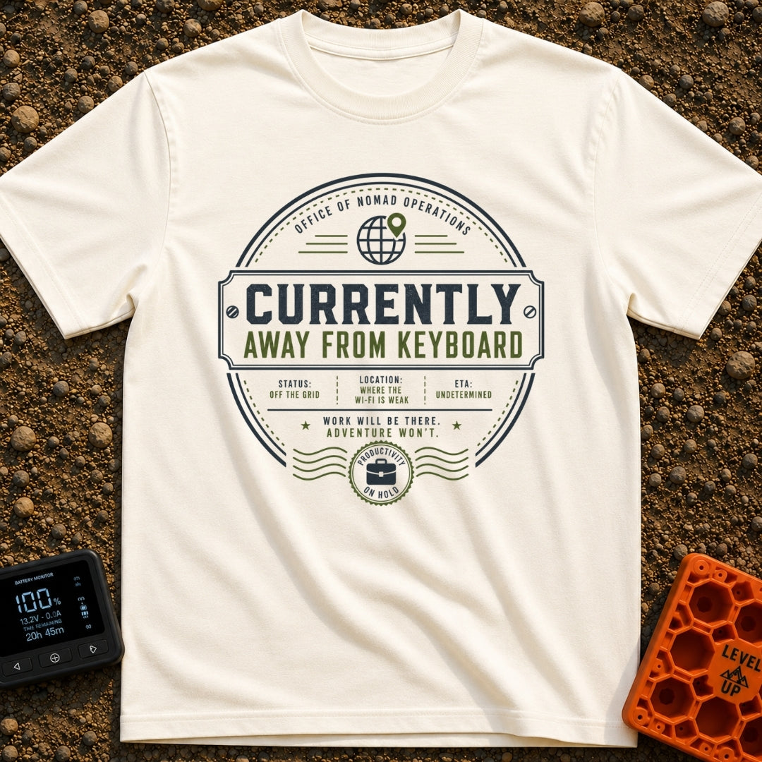 Ctrl Alt Escape - T-Shirt in Ivory - A circular, stamp-like badge design featuring the main text "CURRENTLY AWAY FROM...