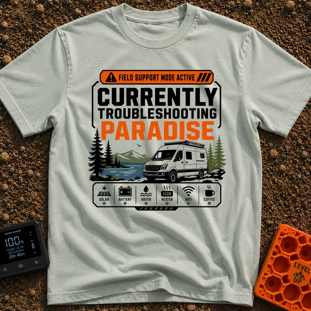 Paradise Debugger Active - T-Shirt in Bay - A white camper van is parked beside a lake with mountains and pine trees in...