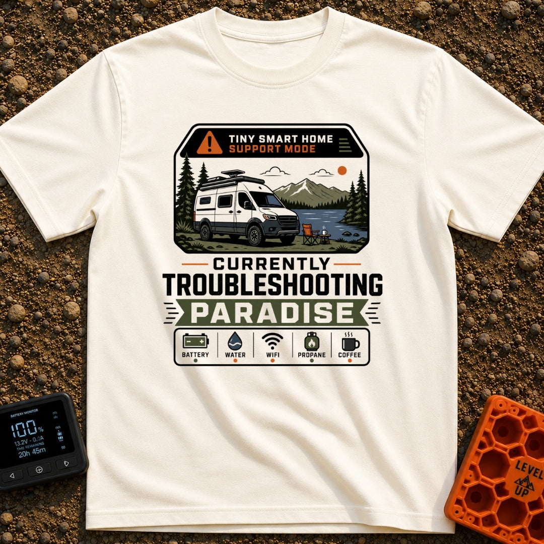 Troubleshooting In Paradise - T-Shirt in Ivory - A white camper van is parked next to a lake with mountains in the...