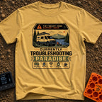 Troubleshooting In Paradise - T-Shirt in Mustard - A white camper van is parked next to a lake with mountains in the...