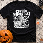 The Awning Curse - T-Shirt in Black - A black-and-white illustration of a mummy tangled in ropes and torn fabric standing...