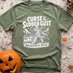 The Awning Curse - T-Shirt in Moss - A black-and-white illustration of a mummy tangled in ropes and torn fabric standing...