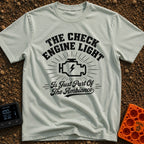 That Check Engine Glow - T-Shirt in Bay - A graphic design featuring the text "THE CHECK ENGINE LIGHT" in distressed...