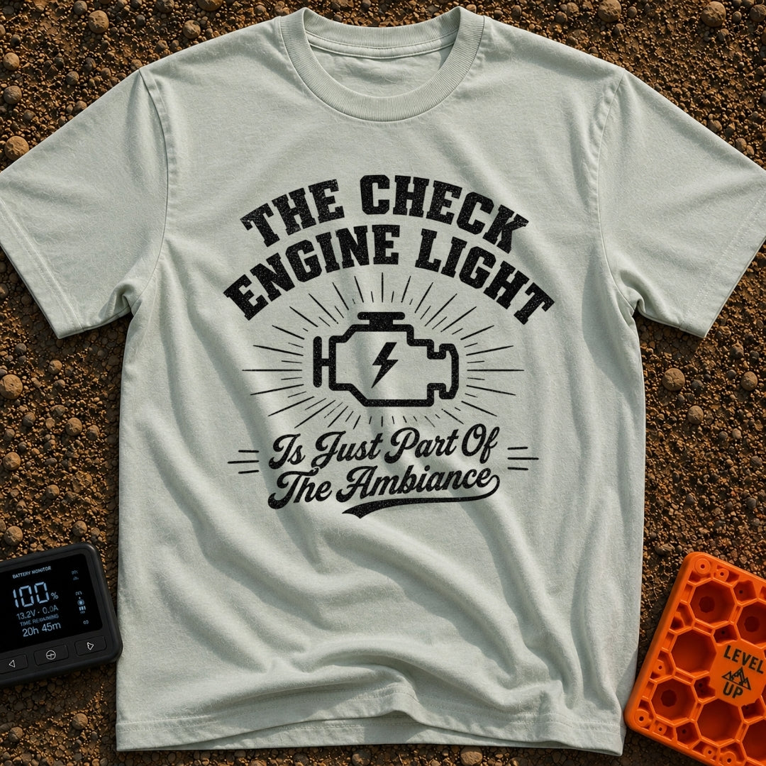 That Check Engine Glow - T-Shirt in Bay - A graphic design featuring the text "THE CHECK ENGINE LIGHT" in distressed...