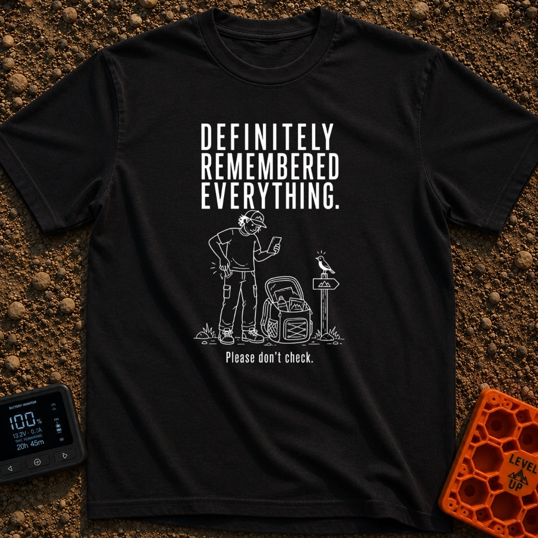 Pretty Sure I Packed - T-Shirt in Black - White line-art illustration of a person in hiking clothes looking down at a...