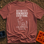 Pretty Sure I Packed - T-Shirt in Brick - White line-art illustration of a person in hiking clothes looking down at a...