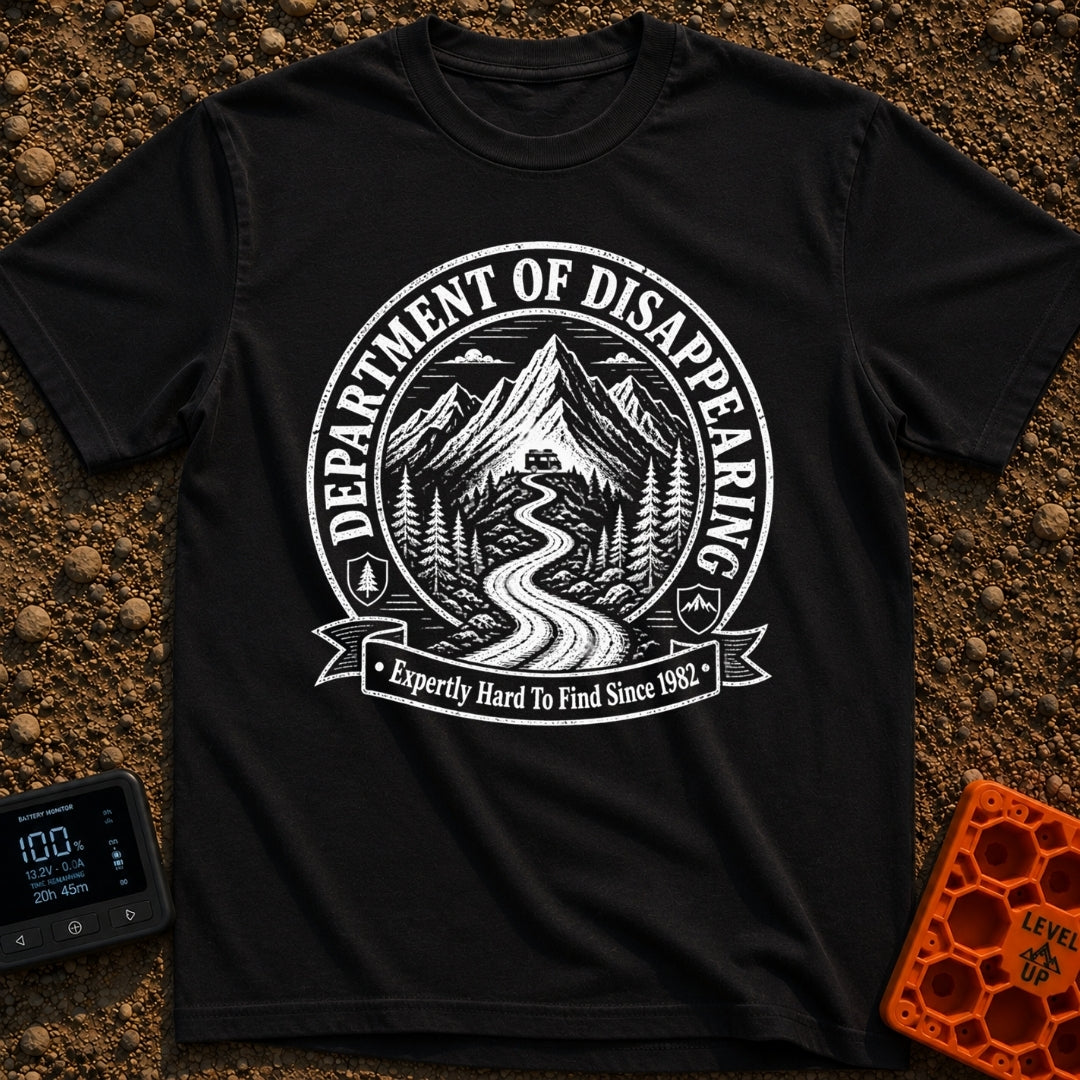 Chief Disappearing Officer - T-Shirt in Black - A black and white circular badge illustration showing a camper van parked...